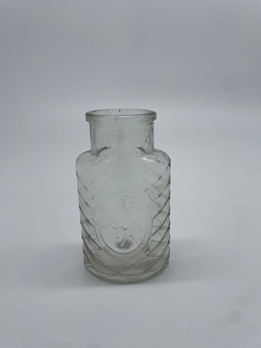 Vintage Clear Glass Bottle with Diamond Lattice & Embossed Tree Medallion